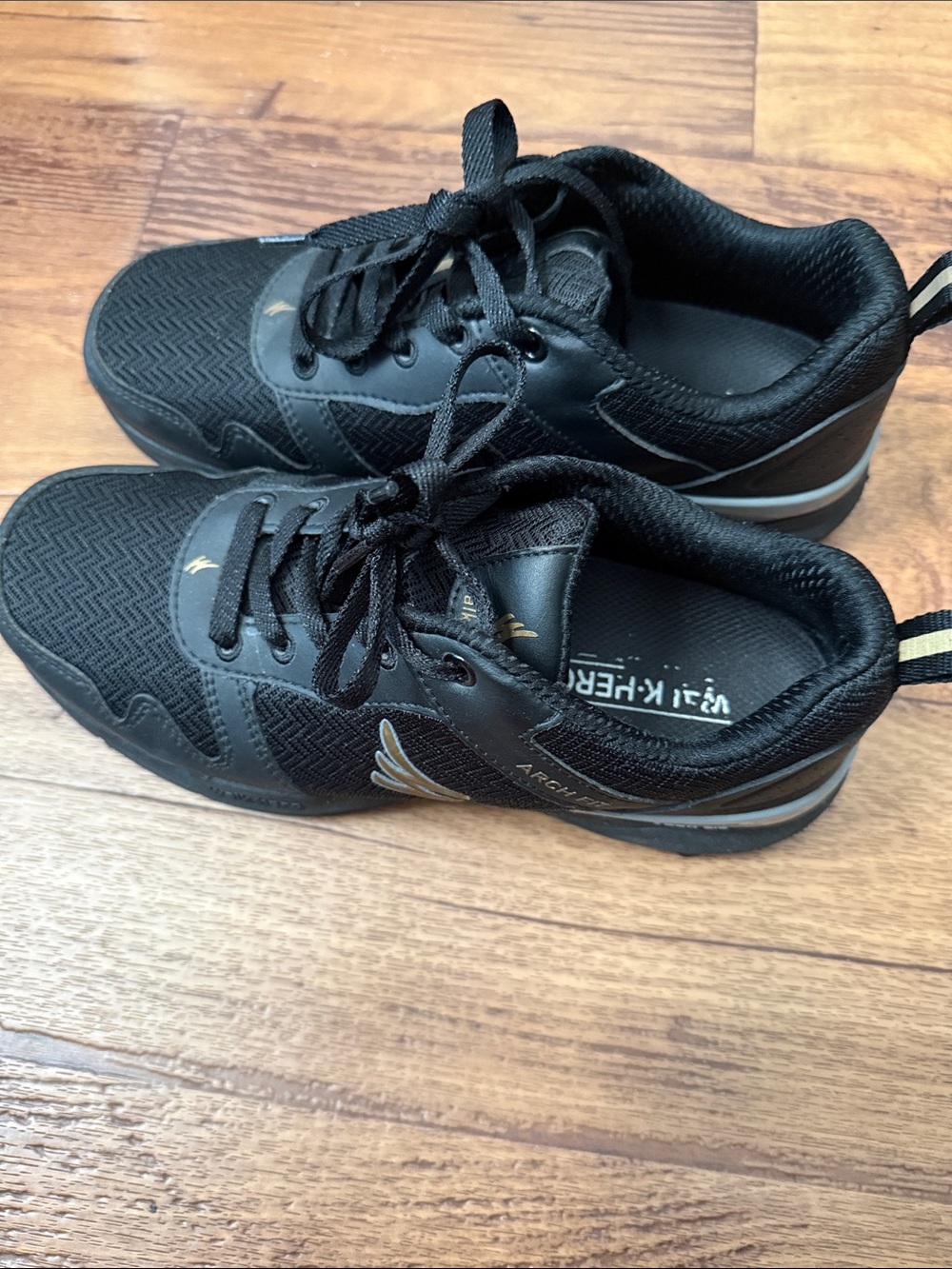 Black Athletic Sneakers with Gold Accent